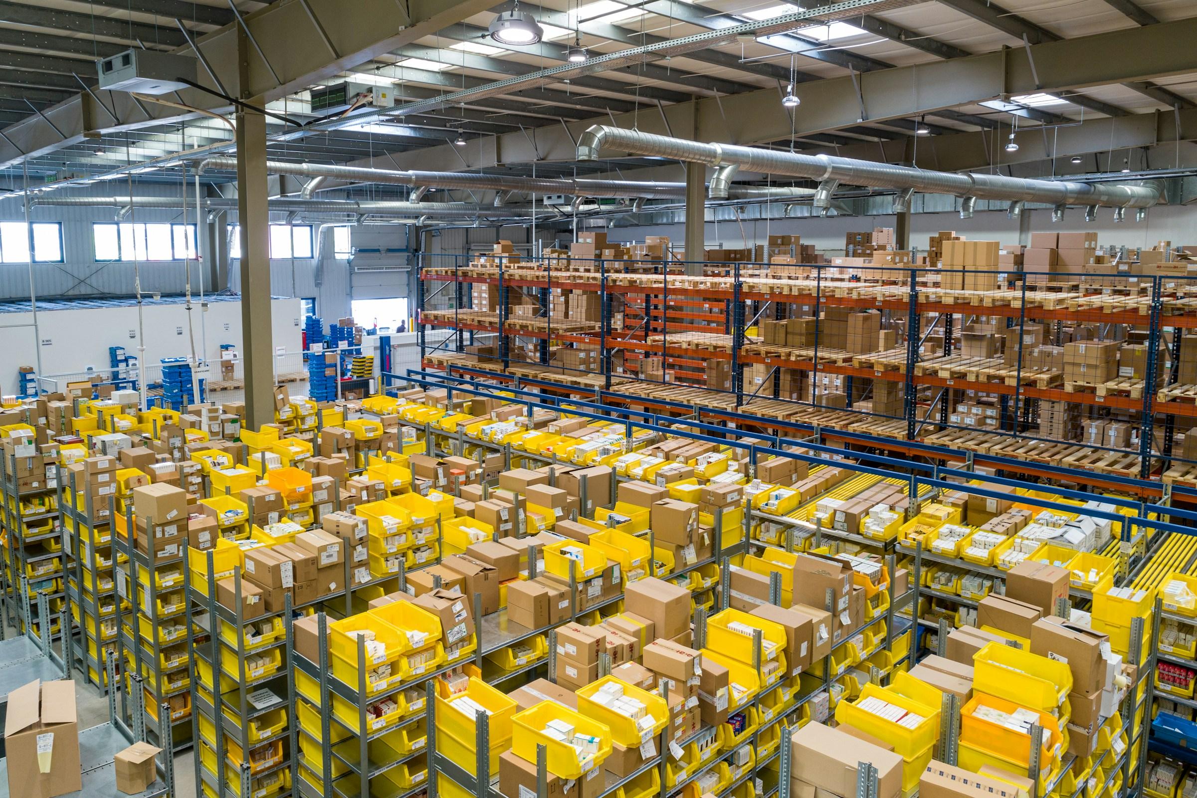 Logistics professional working inside a modern distribution warehouse